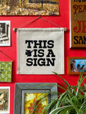 This is a Sign- Small Wall Banner