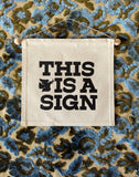 This is a Sign- Small Wall Banner