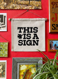 This is a Sign- Small Wall Banner